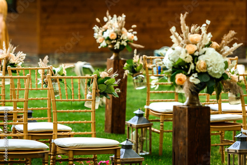 Decoration of the flower arrangement  for the wedding ceremony in the green forest .