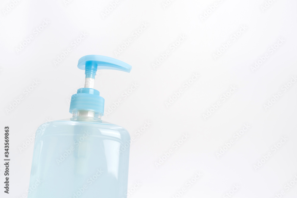 Isolated blue alcohol gel bottle and pump on white background. Isolated blue alcohol gel bottle and pump on white background.