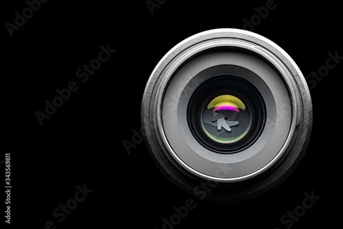 Camera lens on a black background. Copyspace. Isolate on a black background.