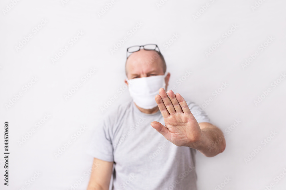 Portrait of an old man, 60-65 years old. Coronavirus hazard concept for the elderly. Man in a medical mask Portrait of an old man, 60-65 years old. Coronavirus hazard concept for the elderly. Man in a medical mask