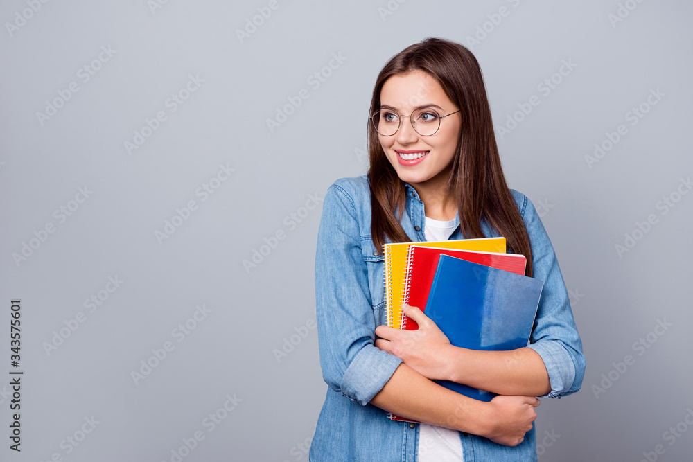 Smart clever intelligent dreamy girl high school student hold note books look copyspace dream she pass her graduation A exam wear casual style outfit spectacles isolated gray color background Smart clever intelligent dreamy girl high school student hold note books look copyspace dream she pass her graduation A exam wear casual style outfit spectacles isolated gray color background