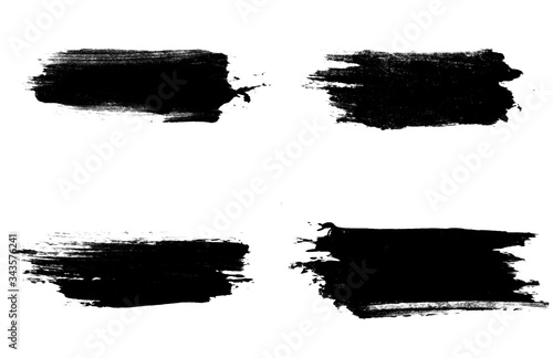set four black strokes of paint isolated on a white background.