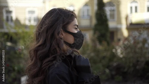 Girl walking alone outdoors during pandemic of COVID-19