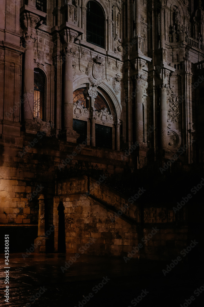 Obraz premium Facade of Cathedral of Santiago de Compostela on a cloudy day at night. Galicia, Spain