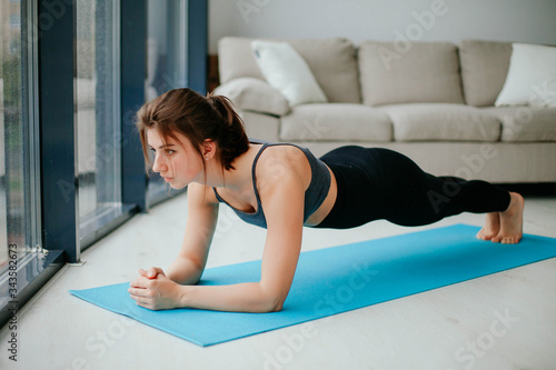 young woman doing fitness. sport at home. 