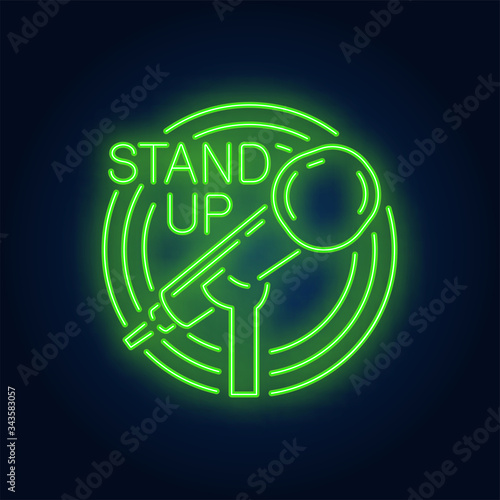 Stand up neon sign. Stand microphone in round frame on brick wall background. Night bright advertisement. Vector illustration in neon style for comedy show