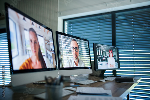 Desk with computers in office interior, business call concept.