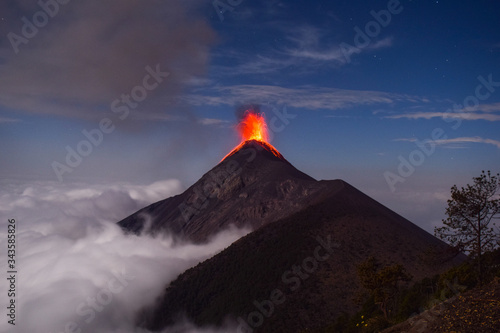 Volcano Eruption at El Volcan del Fuego above clouds in Guatemala from Volcan Acatenango