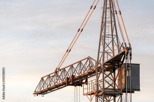Wallpaper Mural tower crane on the background of the sky at sunset. The boom of a construction crane closeup. Torontodigital.ca