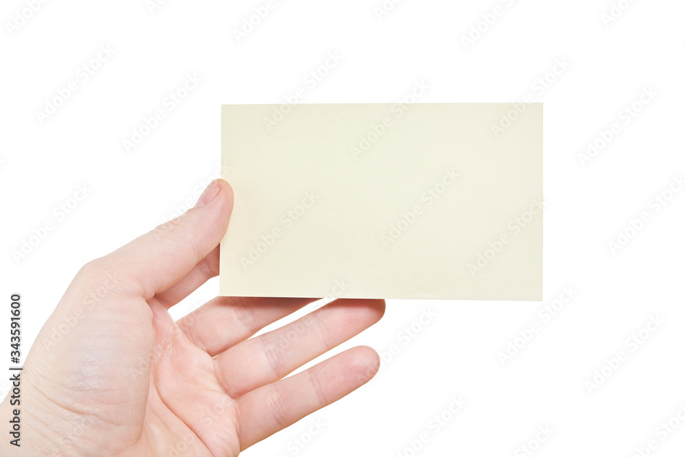 Hand holding a yellow card isolated on white background. Close up