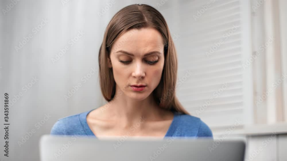 Adorable girl confidently work at notebook watch on device display. Shot with RED camera in 4K Adorable girl confidently work at notebook watch on device display. Shot with RED camera in 4K
