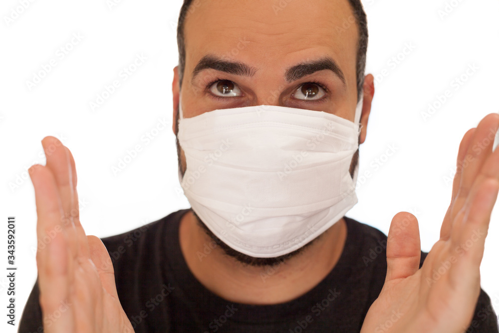 Man with mask to protect himself from coronaviru clapping with isolated white background Man with mask to protect himself from coronaviru clapping with isolated white background