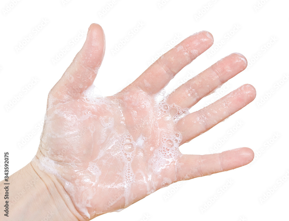 Soaped hand isolated on white background. Close up. Soaped hand isolated on white background. Close up.