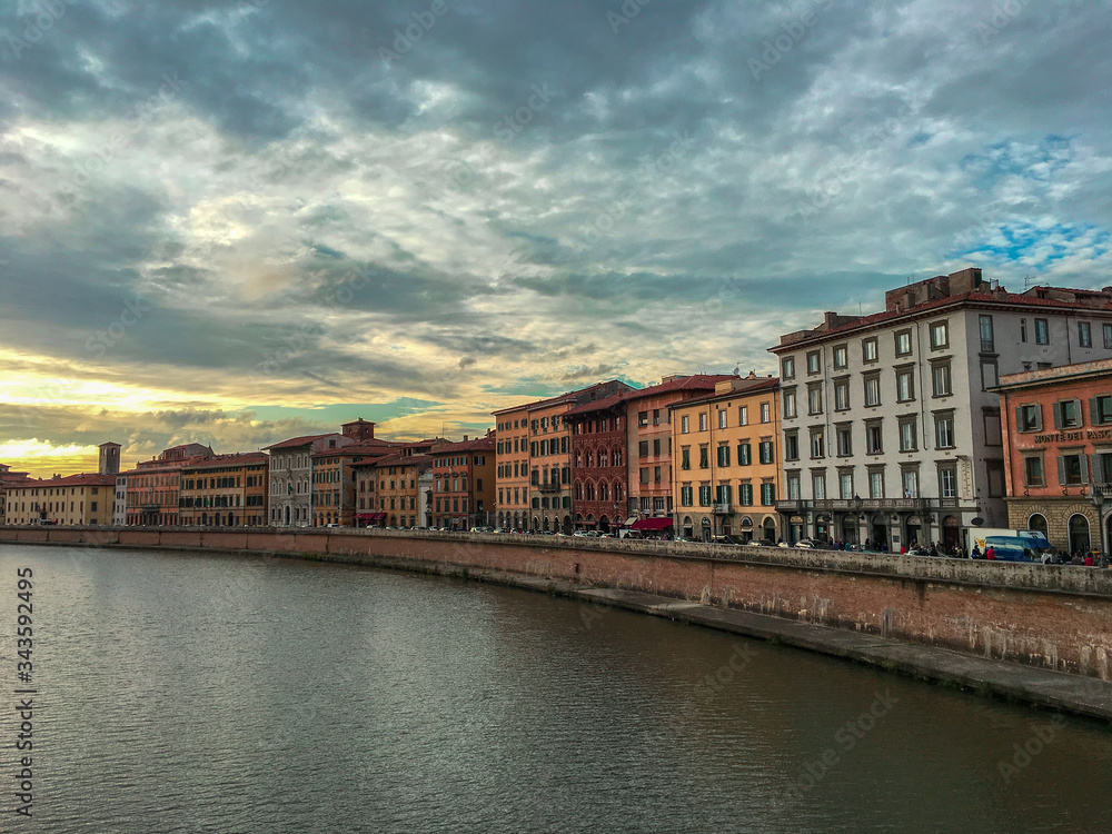 View of old buildings near the river Arno in Pisa, Italy