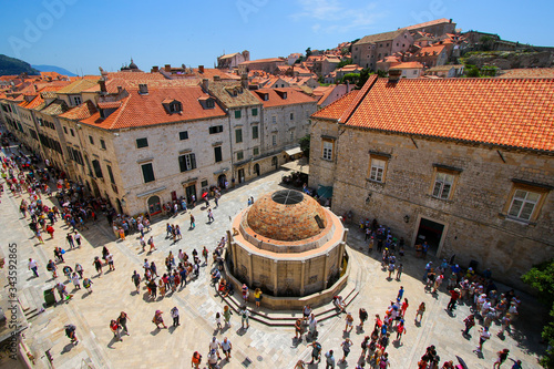 Large Onofrio's Fountain inside Dubrovnik's walled city in Croatia, just after the Pile Gate on the Stradun - Stone medieval buildings and famous tourist destination photo