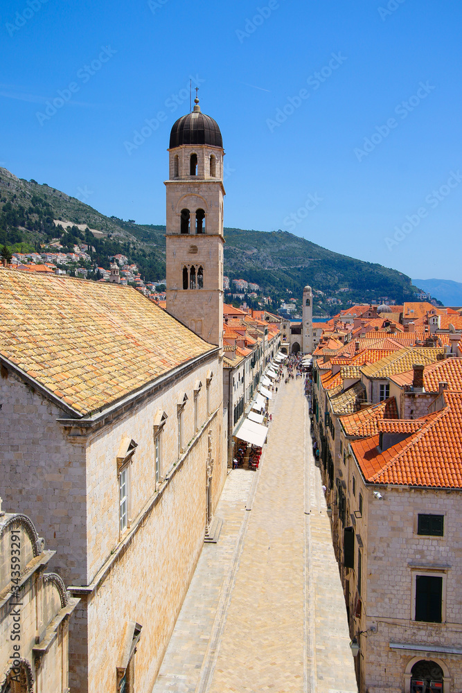 Dubrovnik's Franciscan monastery from the air with a pespective on the Stradun pedestrian street inside the old medievel walled city along the Adriatic Coast in Croatia