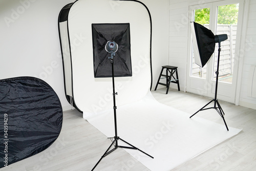 Interior of modern photo studio room with professional equipment