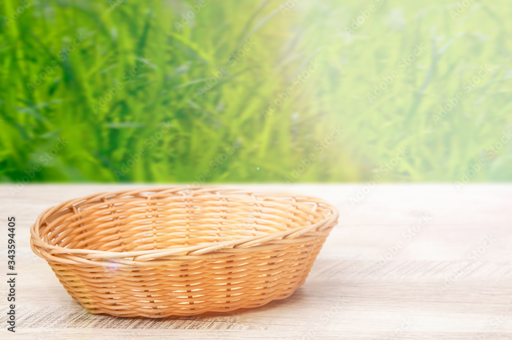 Fototapeta premium Wicker basket on a wooden table