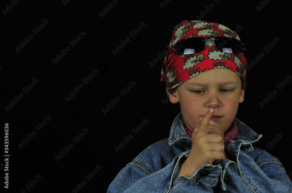 Little boy with gangs headscarf sunglasses and pistol finger Little boy with gangs headscarf sunglasses and pistol finger