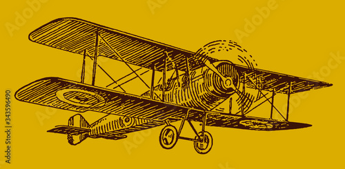 Historical British single-engine biplane isolated on golden background