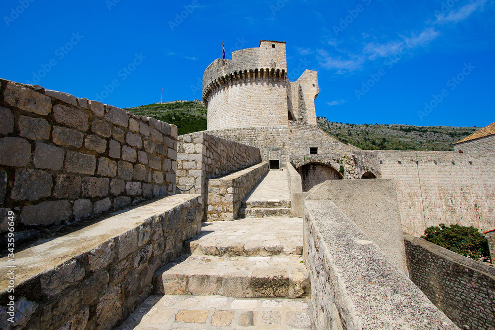 Stoned walkway at the top of Dubrovnik's walls leading to Minčeta Fortress in Croatia - Medieval stronghold along the Adriatic Sea