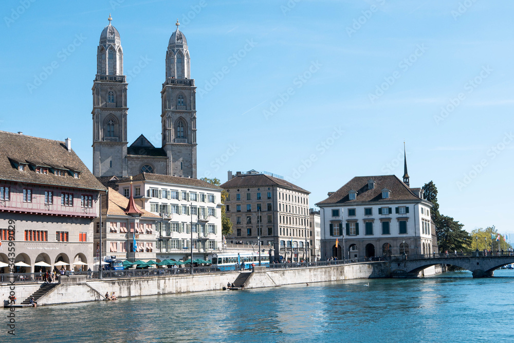 Fototapeta premium View of Grossmunster and Zurich old town from Limmat river. The Grossmunster is a Romanesque-style Protestant church in Zurich