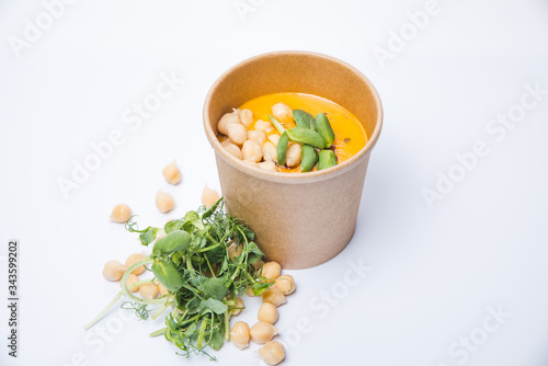 broccoli spinach cream soup on rustic wooden background