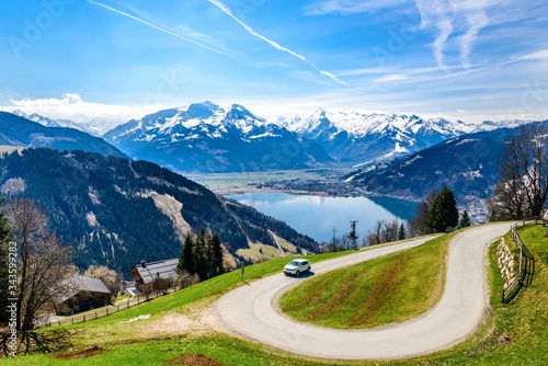 Zell am See. Panorama view on Zellersee lake with alps, green fields, blue sky.  Zillertal. Austria, Tirol