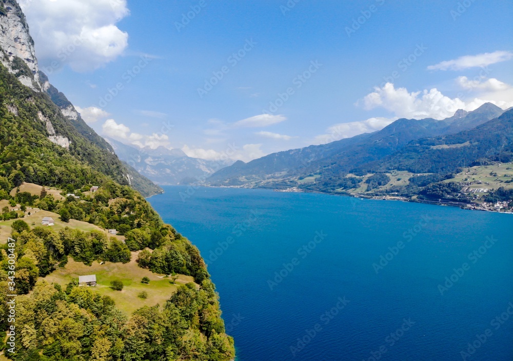 Fototapeta premium Aerial view on Walensee (Lake Walen) nearby Beltis, Weesen, Amden. Canton St. Galen, Glarus, Switzerland