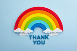 Thank you rainbow banner. Rainbow ob blue background with letters