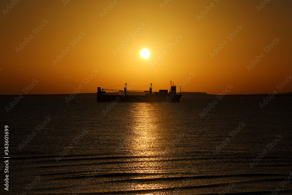 ship on the background of the Golden sunrise