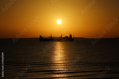ship on the background of the Golden sunrise