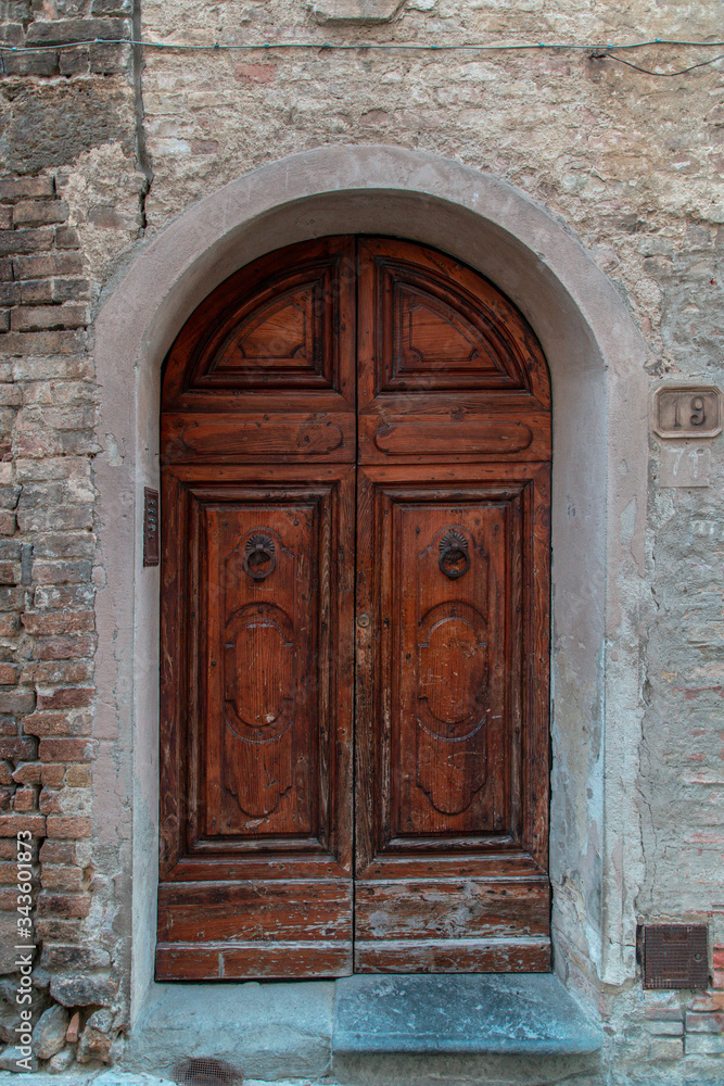 Old door in Florence in dark brown