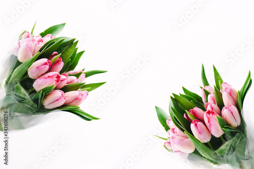 Fototapeta Naklejka Na Ścianę i Meble -  Two bouquets of pink tulips on white isolated background.