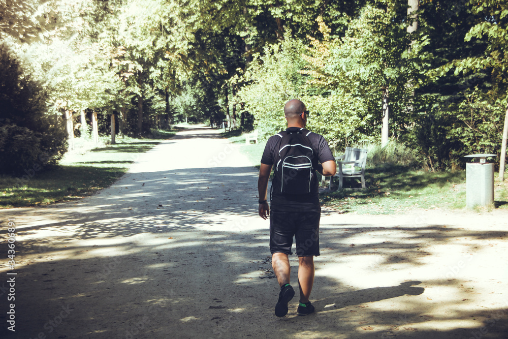 Fototapeta premium Hiker hiking in a park