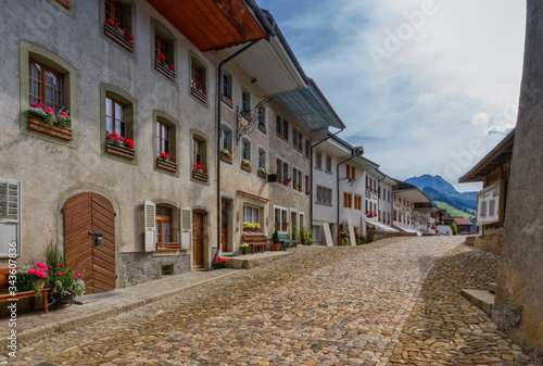 Street in Gruyere village in Fribourg canton by beautiful day, Switzerland