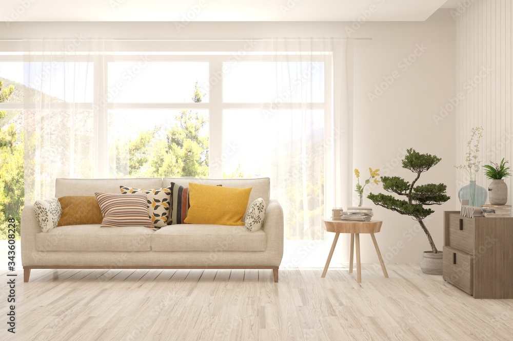 Fototapeta premium White living room with sofa and summer landscape in window. Scandinavian interior design. 3D illustration