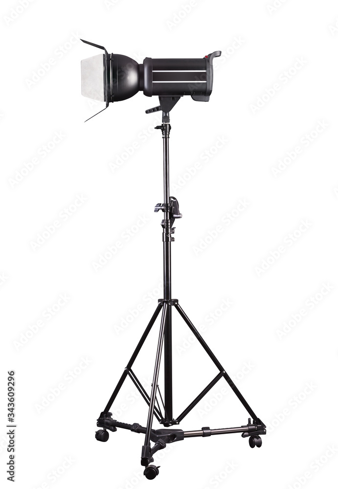 Photography studio flash on a lighting stand isolated on white background.