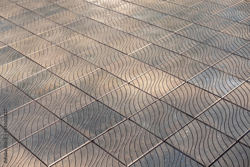 Obraz premium old gray square tiles with wavy patterns. rough surface texture