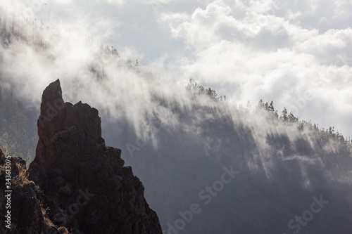 Fog and clouds over volcano's slopes in Teide National Park, Tenerife, Canary Islands, Spain.
