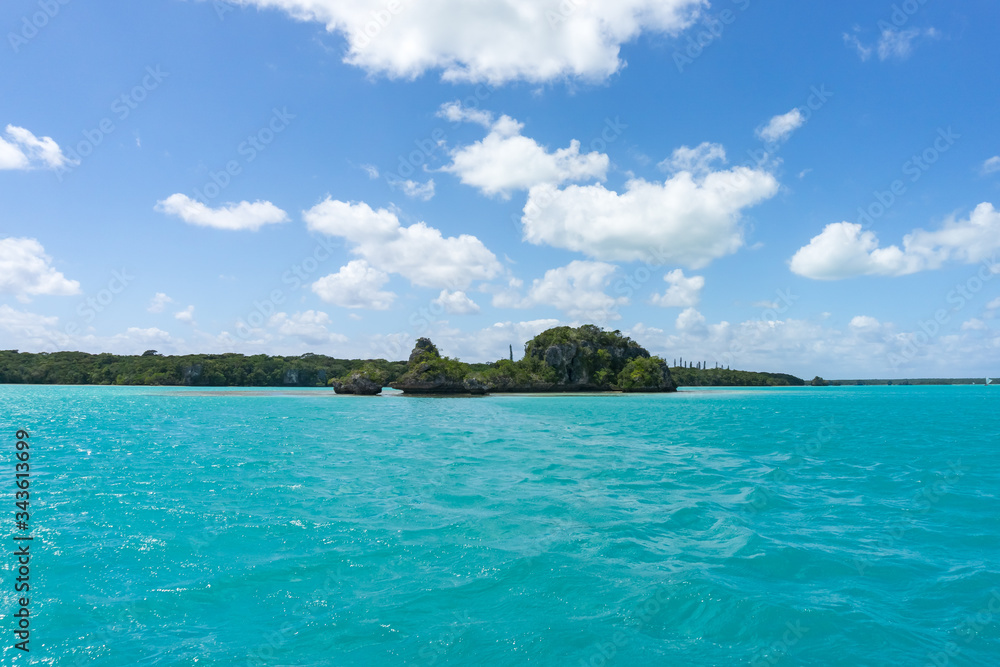 seascape of famous Upi bay, new caledonia: turquoise lagoon, typical rocks, blue sky seascape of famous Upi bay, new caledonia: turquoise lagoon, typical rocks, blue sky