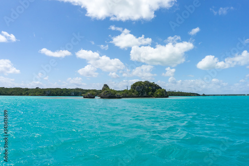 seascape of famous Upi bay, new caledonia: turquoise lagoon, typical rocks, blue sky