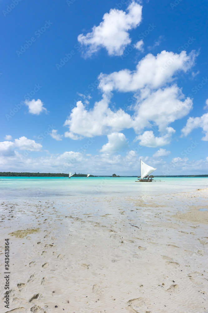 Obraz premium traditional caledonian sailing boat on turquoise water in Upi bay