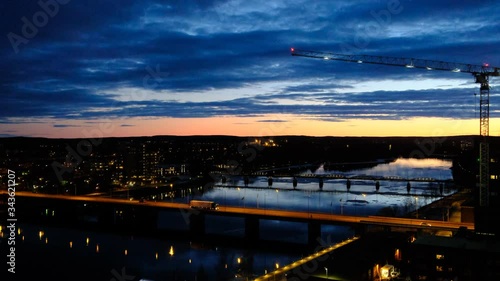 Umea river and bridges at sunset, cityscape, Umea, Sweden