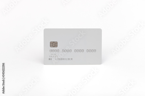 White credit card on a white background with natural shadow