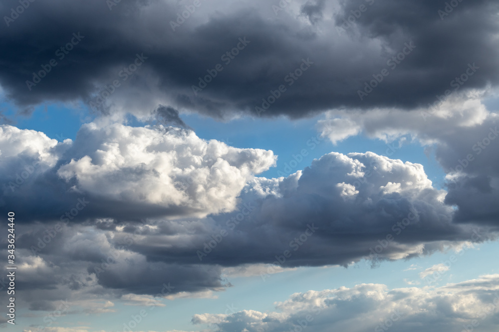 Scenic cloudy blue sky. Sunlight in high large dramatic cloudscape moody background Scenic cloudy blue sky. Sunlight in high large dramatic cloudscape moody background