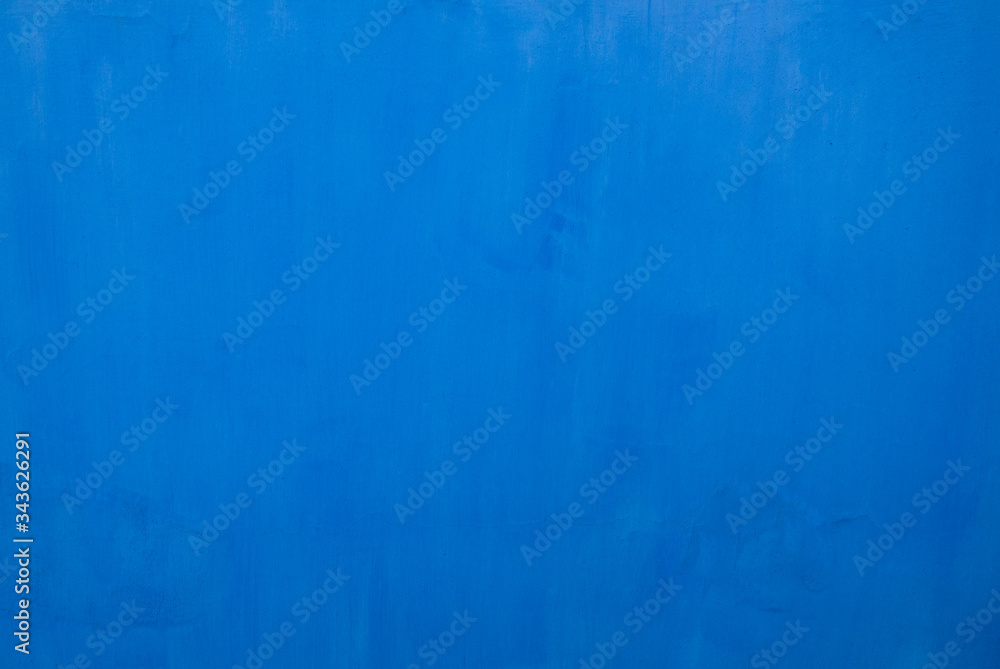 Bright sky blue painted surface with texture