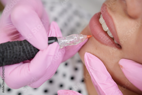 Permanent lip liner coloring around the vermilion border of the lips professional service