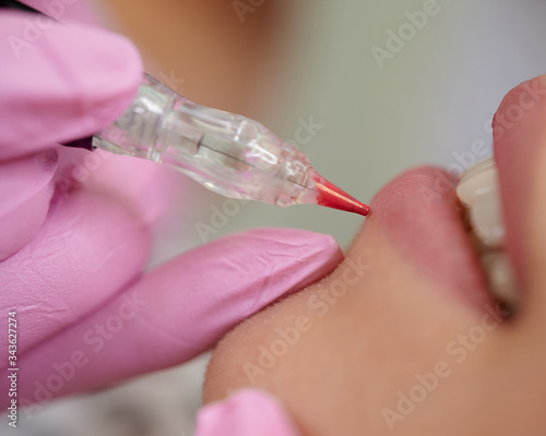 Permanent lip liner coloring around the vermilion border of the lips close up