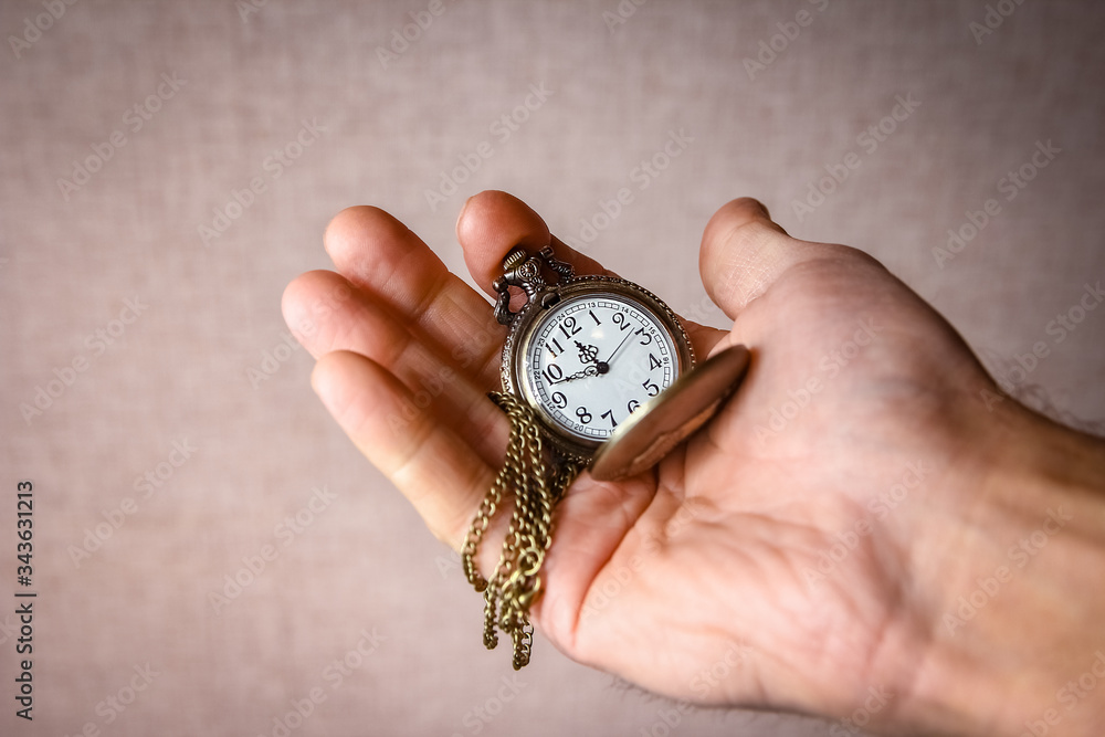 a pocket watch in the hands of a man a pocket watch in the hands of a man